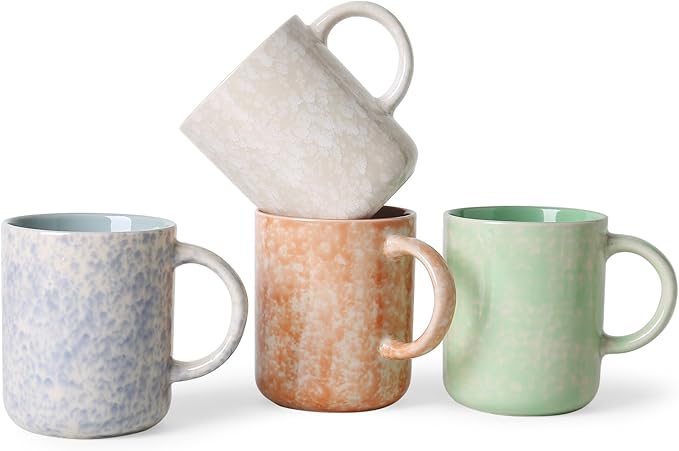 Ceramic coffee mug set with speckled blue, orange, and green mugs and handles