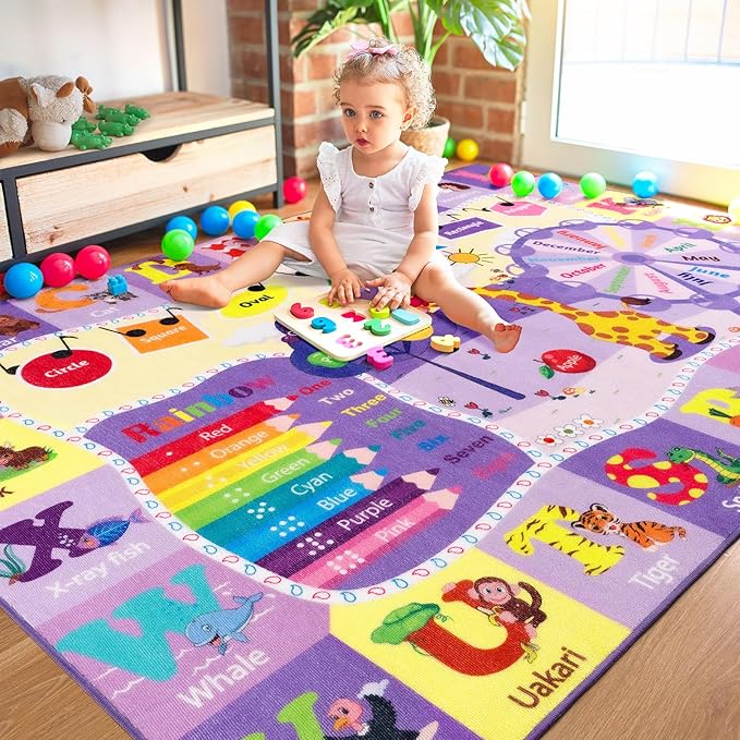 Kids purple ABC animal rug with colorful rainbow road and large letter/word blocks.