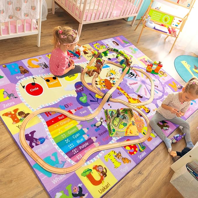 Kids purple learning rug featuring animals, letter panels, and a rainbow track for toddlers.
