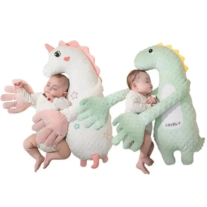 Pink plush baby sleep soother shaped like a unicorn, with star and heart details.