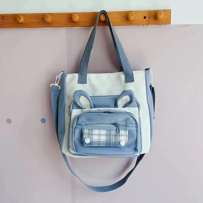 Blue and white bunny-ear tote shoulder bag with front plaid pocket and side zip