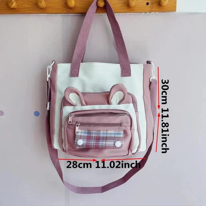 Pink bunny-ear tote shoulder bag with front plaid pocket and side compartments