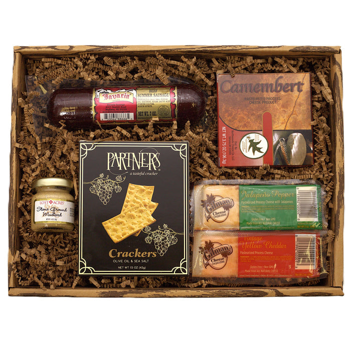 Charcuterie snack gift box with salami, crackers, cheese spread and meat packages