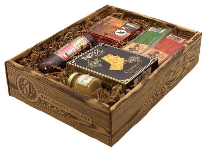Charcuterie snack gift box with salami, crackers, cheese spread and packaged items