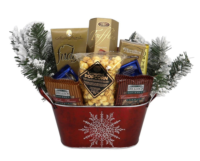 Holiday gift basket with red snowflake design and assorted popcorn, cookies, and chocolates