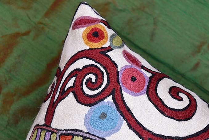 White pillow cover side view with multicolor swirl and dot pattern