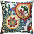 Embroidered floral pillow cover with teal, red, blue and green circular motifs on cream base
