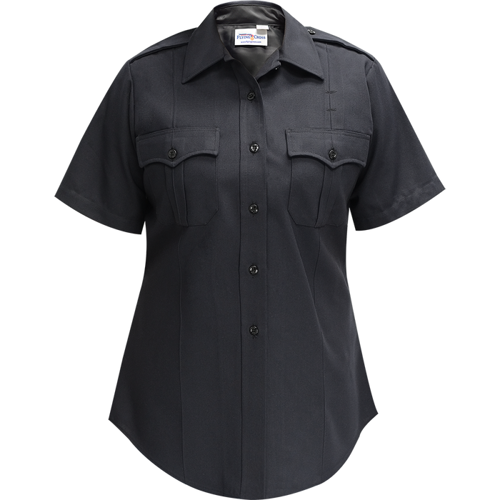 Product shot of a Flying Cross women's short sleeve dark navy blue uniform shirt featuring a button-down front, two breast pockets with flaps, and black buttons.