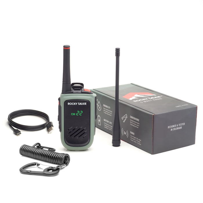 Rocky Talkie 5 Watt Expedition Radio in Sage Green, view of all contents with packaging. Radio, 17cm antenna, coil leash, usb charge cord, and recycled cardboard packaging