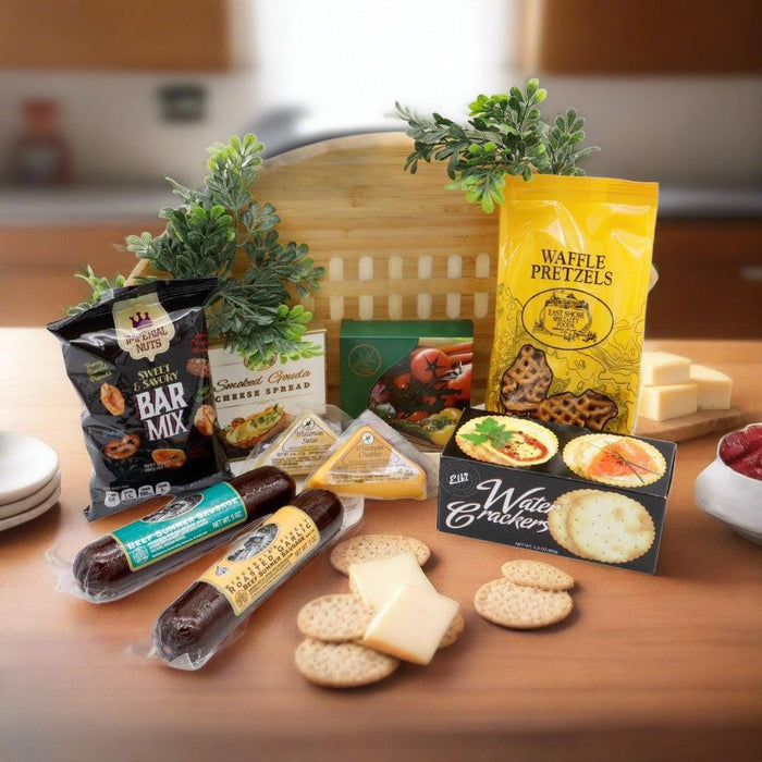 Game Day cutting board gift set with round bamboo board and assorted packaged snacks