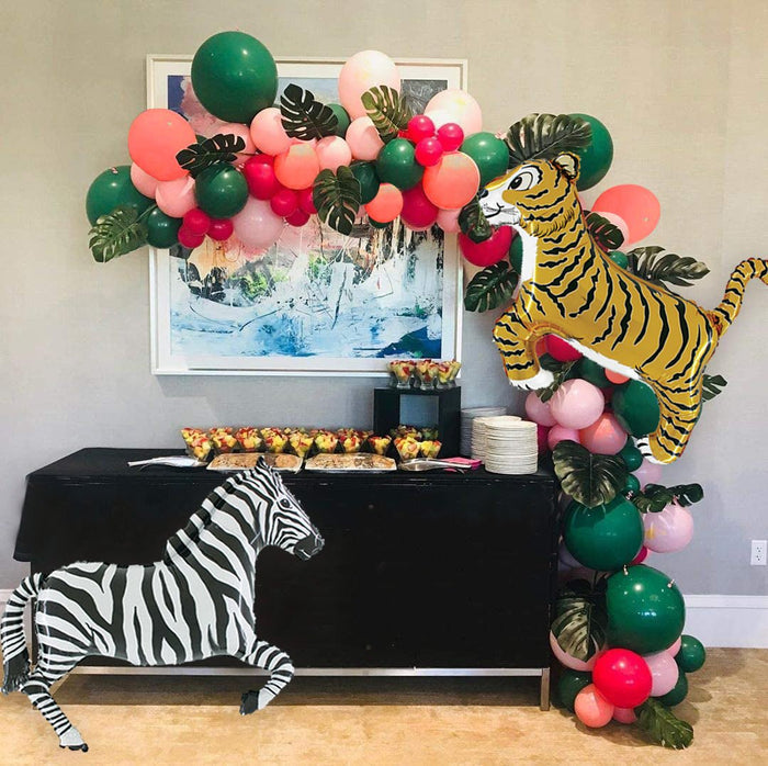 Safari balloon garland with tiger balloon and zebra balloon, pink and green balloon clusters