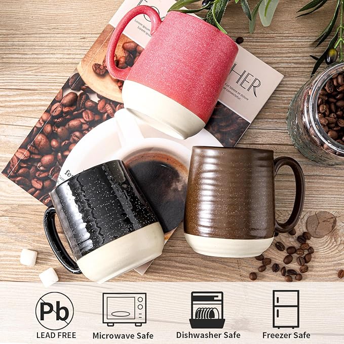 Ceramic coffee mugs with handles, red and black plus bronze colors on wooden tabletop