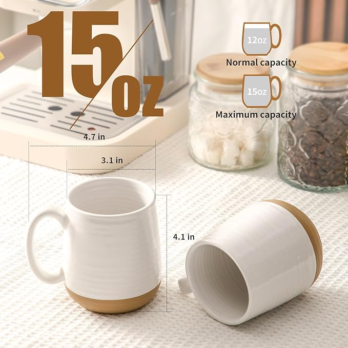 15 oz ceramic coffee mugs, white exterior and handle, one mug upright and one tilted