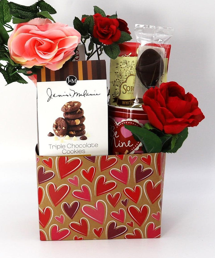 Heart-pattern gift box with roses, cookies, and wrapped chocolate items