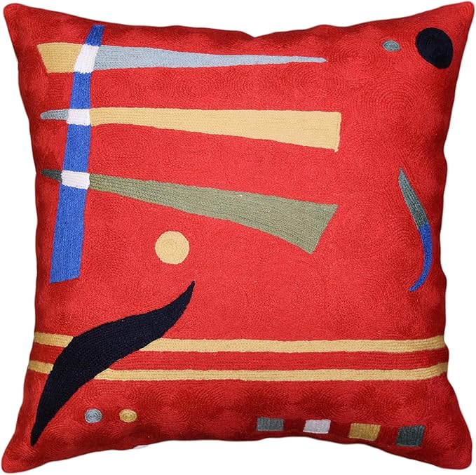 Red abstract pillow cover with geometric lines, shapes, and a dark bird