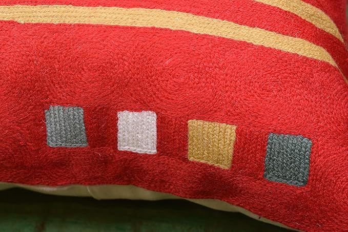 Red abstract pillow cover corner with multicolor small square accents