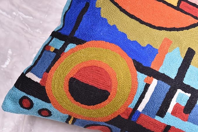 Blue abstract pillow cover corner with circular ring and multicolor shapes
