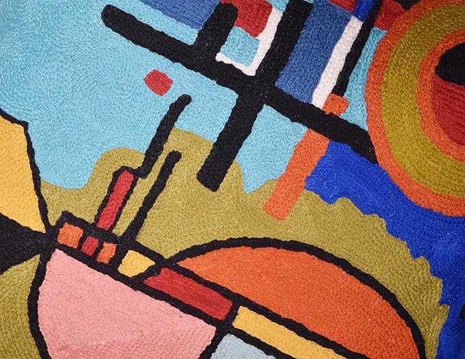 Blue abstract pillow cover detail of black grid lines and colorful striped accents