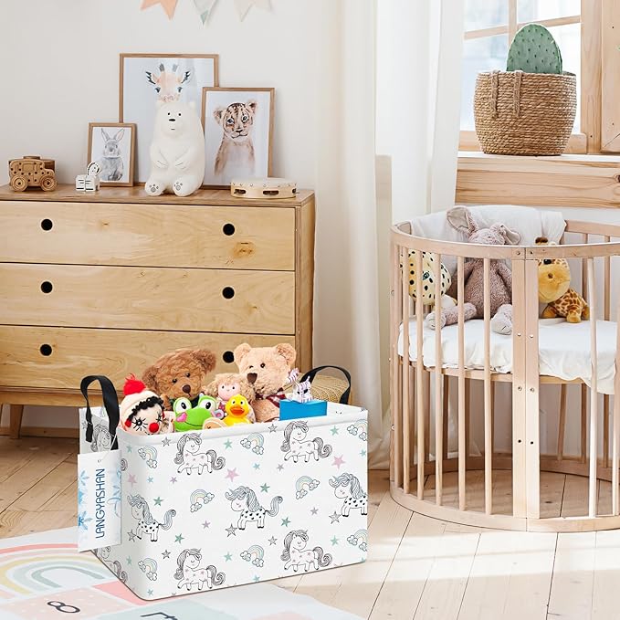 Rectangular canvas storage bin with handles, white unicorn print, holding plush toys