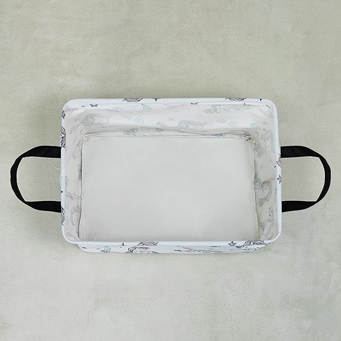 Rectangular collapsible canvas storage bin, white with small unicorn print, top view