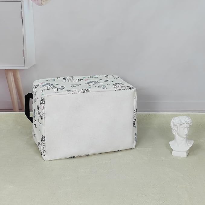 Rectangular canvas storage bin with handles, white fabric with unicorn print, side view
