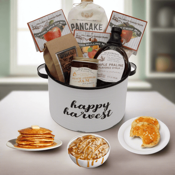 Gift basket with Happy Harvest bucket, pancake mix, syrup, and jam jars