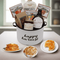 Gift basket with Happy Harvest bucket, pancake mix, syrup, and jam jars