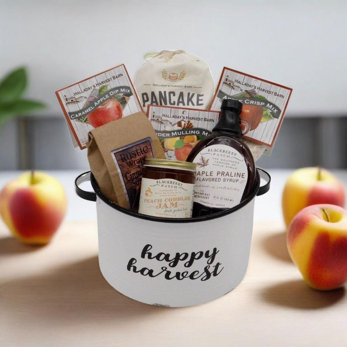 Gift basket with Happy Harvest bucket, pancake mix boxes and jam, syrup bottle
