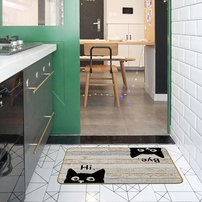 Grey kitchen entry doormat with black cat faces and “Hi” and “Bye” text