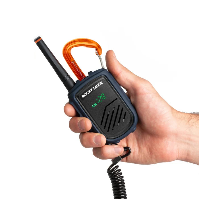 Hand holding a Rocky Talkie Mountain Radio walkie talkie, comfortably fits in palm