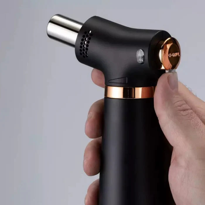 The O-Grill GJ-ONE professional precision flame torch in hand.