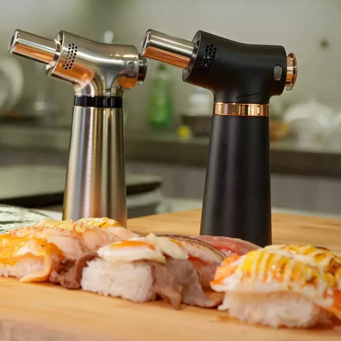 A pair of O-Grill GJ Torches in silver and black