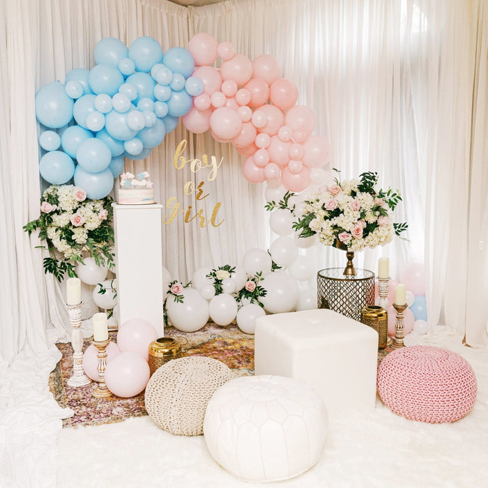 Pastel blue and pink latex balloon arch with matching balloon cluster