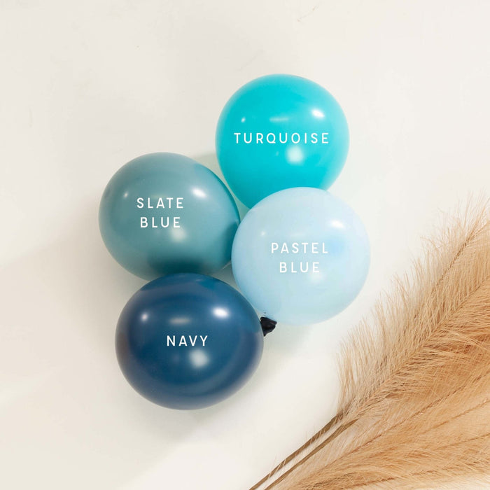 Pastel blue latex balloon group with navy, slate blue, and turquoise balloons