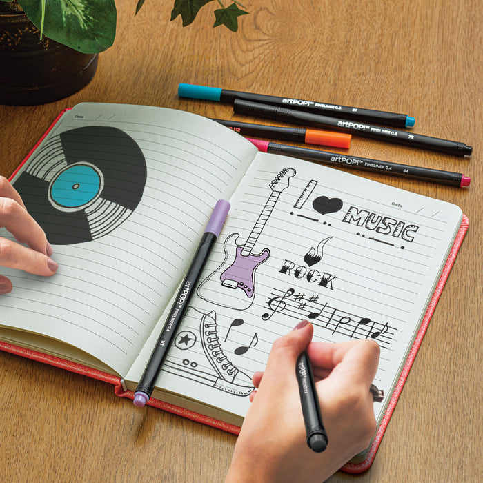 artPOP! Rainbow Hardcover Notebook (person sketching in notebook)