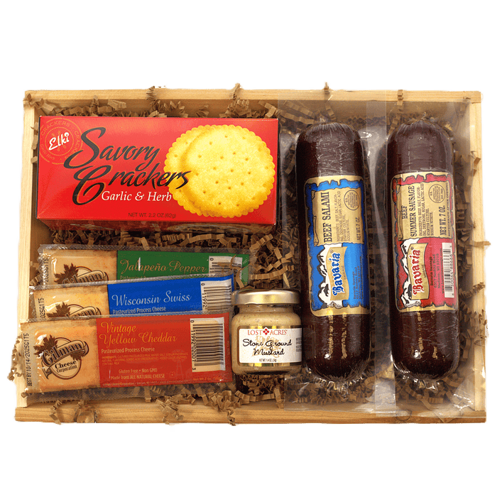 Meat and cheese gift crate with crackers, cheese spread, and two dark sausages
