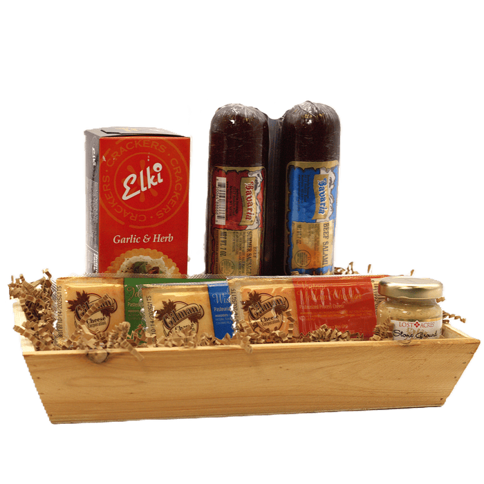 Meat and cheese gift crate with crackers, cheese bites, and two dark sausage bottles