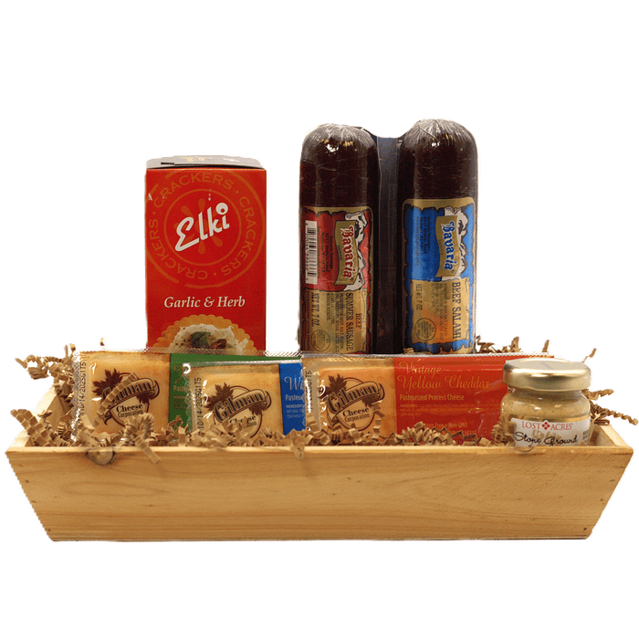 Meat and cheese gift crate with crackers, cheese jar, and two dark sausage bottles