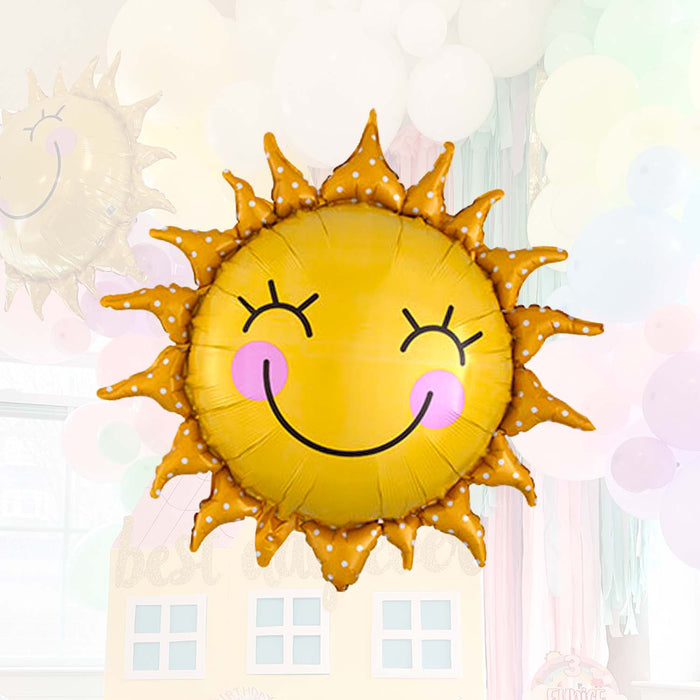 Smiling sun balloon with stitched yellow face, orange dotted rays, pink cheeks and smile
