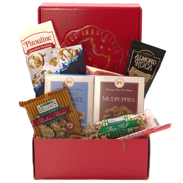 Sweet Indulgence gift box open, showing chocolate bars, caramel snacks, and nut brittle