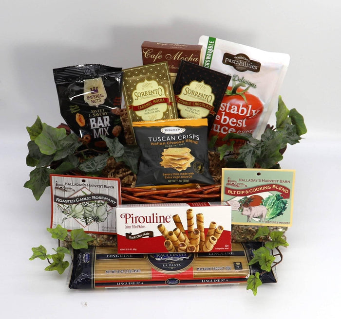 Italian gourmet gift basket with assorted crackers, pasta snacks, and greenery