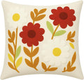 Floral throw pillow cover in white with red, yellow, and green punch-needle flowers