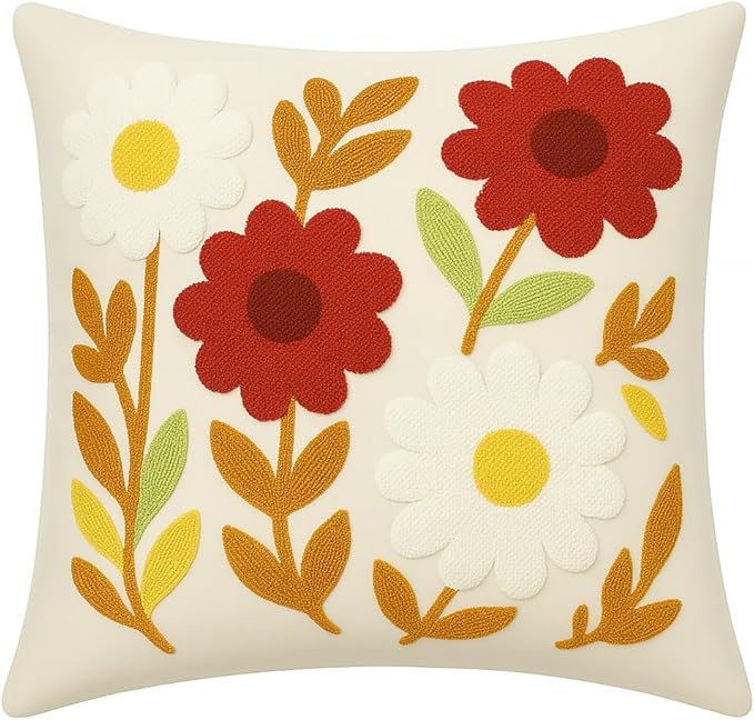 Floral throw pillow cover in white with red, yellow, and green punch-needle flowers
