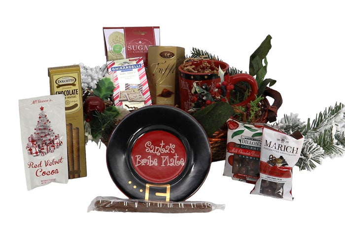 Christmas gift basket with round black tin, chocolates, and red pine decor