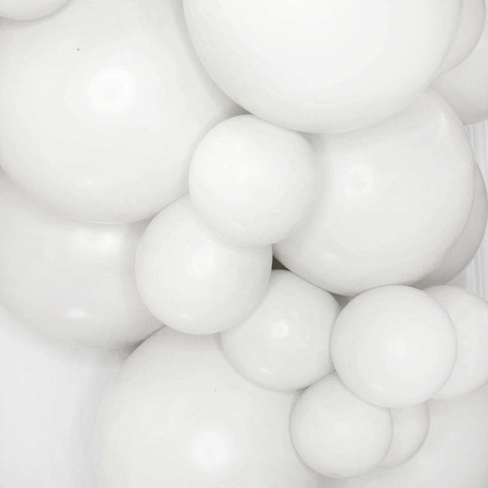White balloon garland close-up of glossy round white balloon clusters