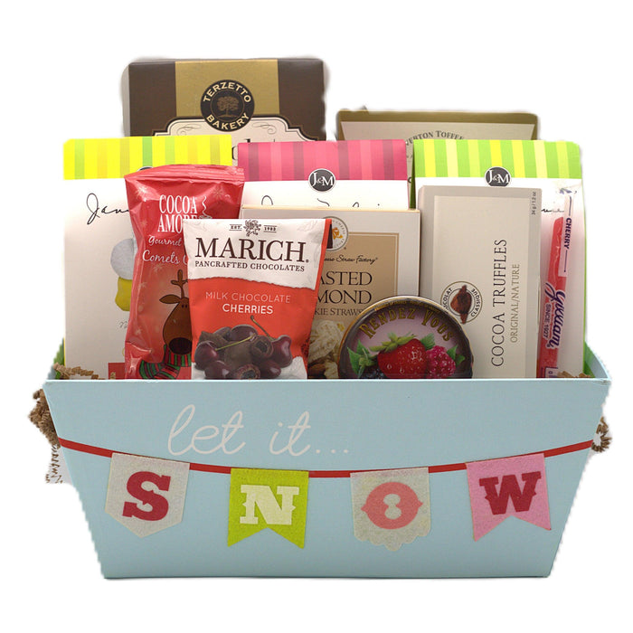 Blue gift basket with "Let it snow" banner, filled with chocolate and cookie packages